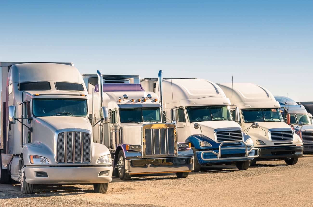 white semi trucks parked