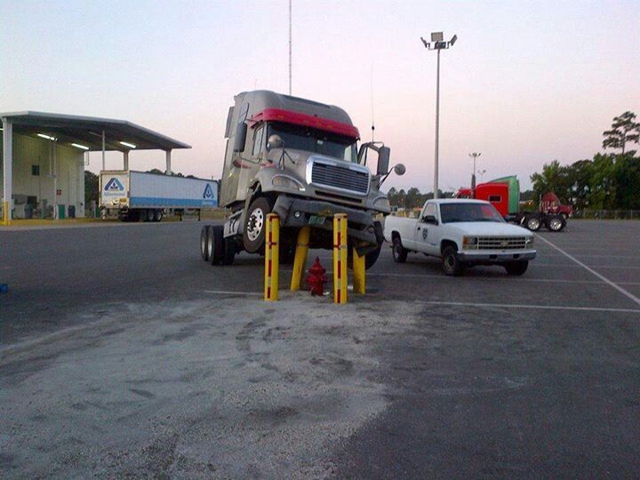 semi truck stuck on parking poll